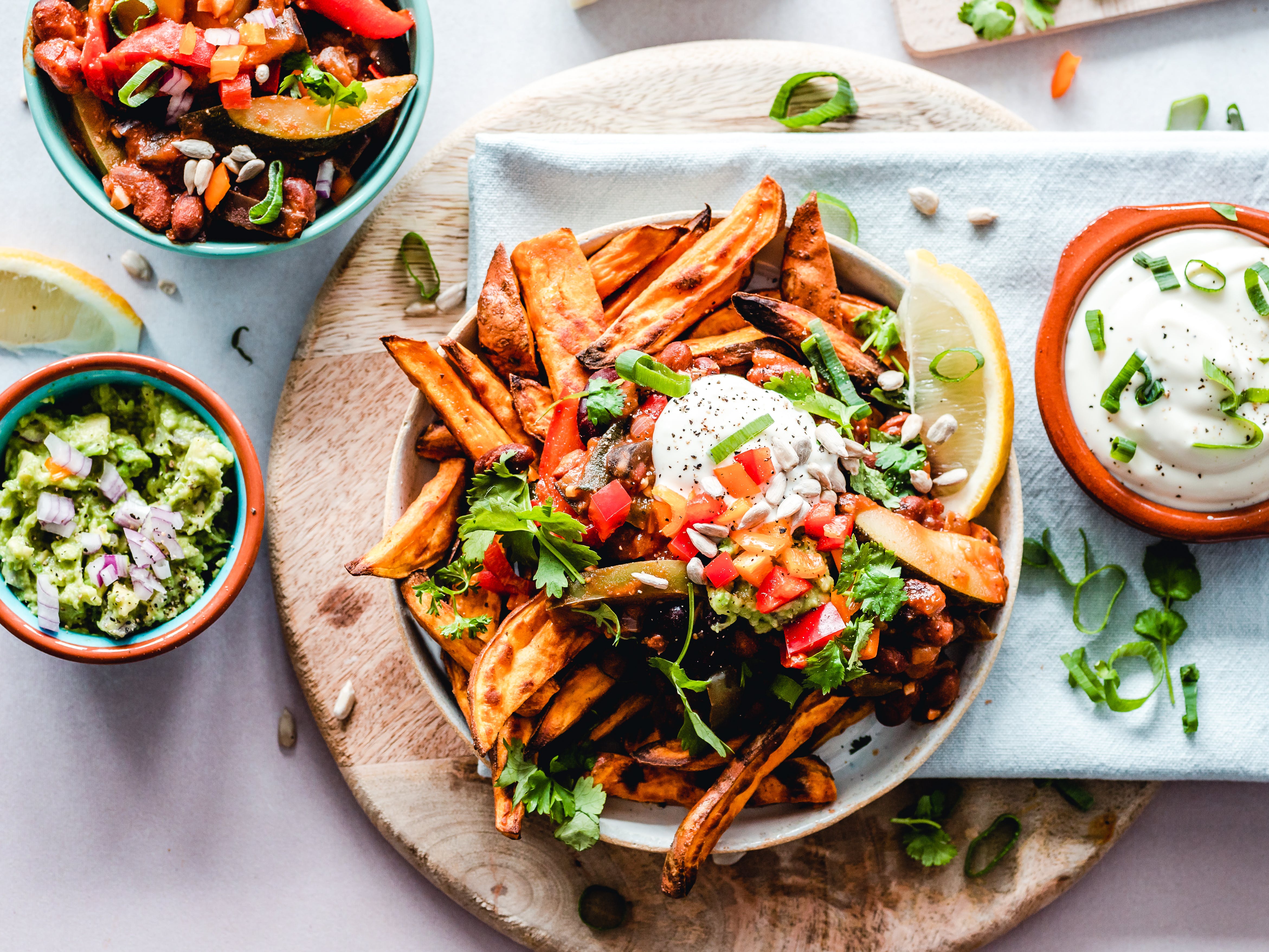 Plate of sweet potato fries, egg and salad